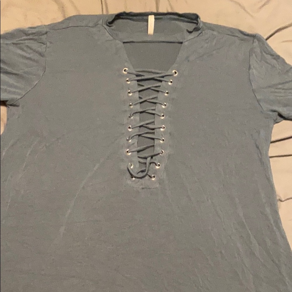 turtle neck t shirt with open crisscross in middle